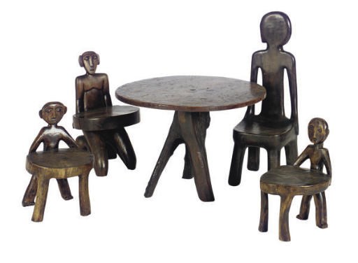 A SET OF NATIVE FIGURAL HARDWOOD LOW TABLE AND CHAIRS,