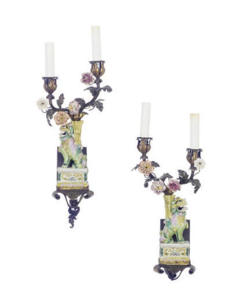 A PAIR OF GILT-METAL MOUNTED CHINESE PORCELAIN FOO DOG TWO-BRANCH WALL-LIGHTS,