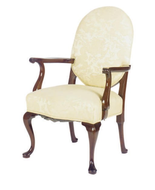 A CARVED MAHOGANY CREAM UPHOLSTERED ARMCHAIR,