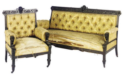 AN AMERICAN RENAISSANCE REVIVAL EBONIZED SOFA AND CHAIR,