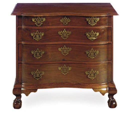 AN AMERICAN CHIPPENDALE MAHOGANY REVERSE-SERPENTINE CHEST OF DRAWERS,