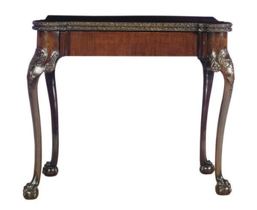AN ENGLISH CARVED MAHOGANY FOLD OVER CARD TABLE,