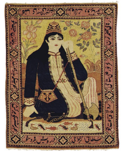 A PICTORIAL KIRMAN RUG,