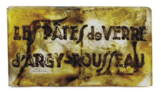 A FRENCH PATE-DE-VERRE TRADE SIGN,