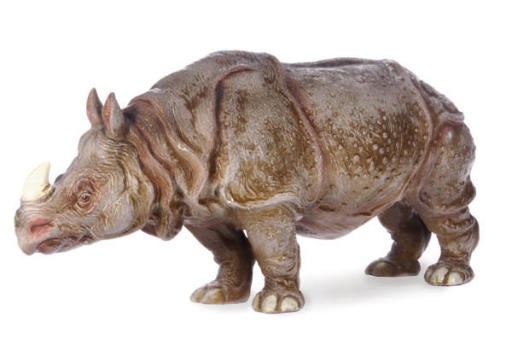 AN ITALIAN TIN GLAZED EARTHENWARE FIGURE OF A RHINOCEROS,