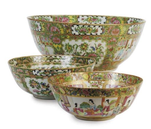 A CHINESE EXPORT CANTON FAMILLE ROSE MEDALLION PUNCH BOWL AND TWO SMALLER SIMILAR BOWLS,