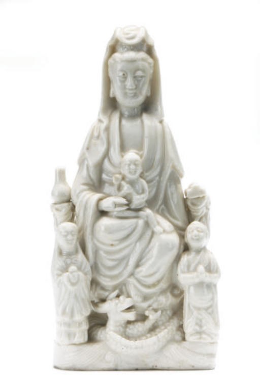 A CHINESE BLANC-DE-CHINE FIGURE OF GUANYIN AND ACOLYTES,