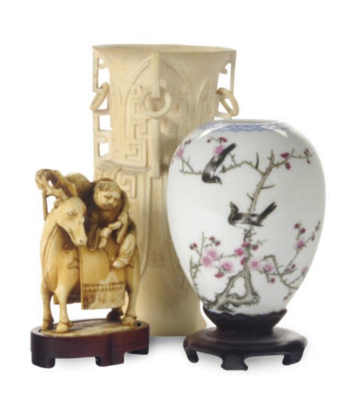 A SMALL CHINESE IVORY GROUP OF AN IMMORTAL AND DEER,