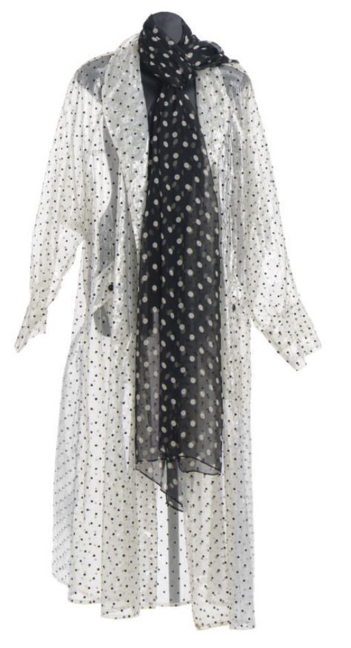 A BLACK AND WHITE POLKA DOT RAINCOAT,