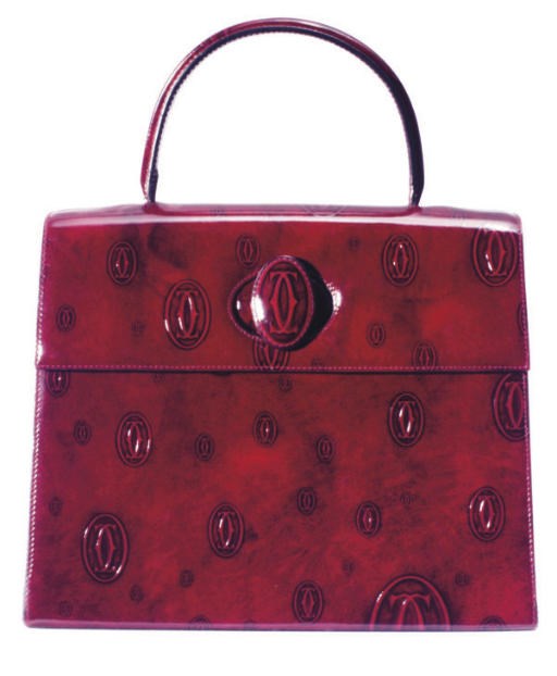 A CARTIER BURGUNDY PATENT LEATHER HANDBAG,