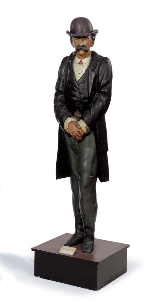A CARVED AND PAINT-DECORATED 'GENTLEMAN OF FASHION' TRADE FIGURE