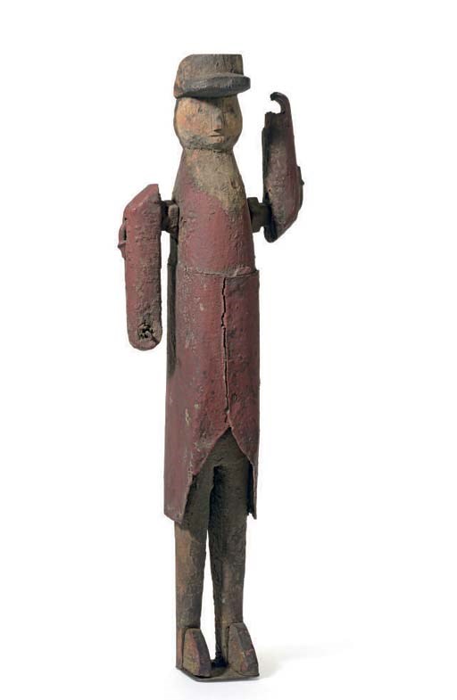 A CARVED AND PAINT-DECORATED WOOD AND TIN SOLDIER WHIRLIGIG