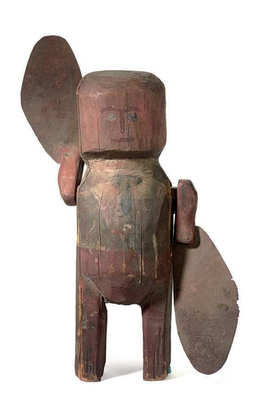 A CARVED AND PAINT-DECORATED WOOD AND TIN WHIRLIGIG