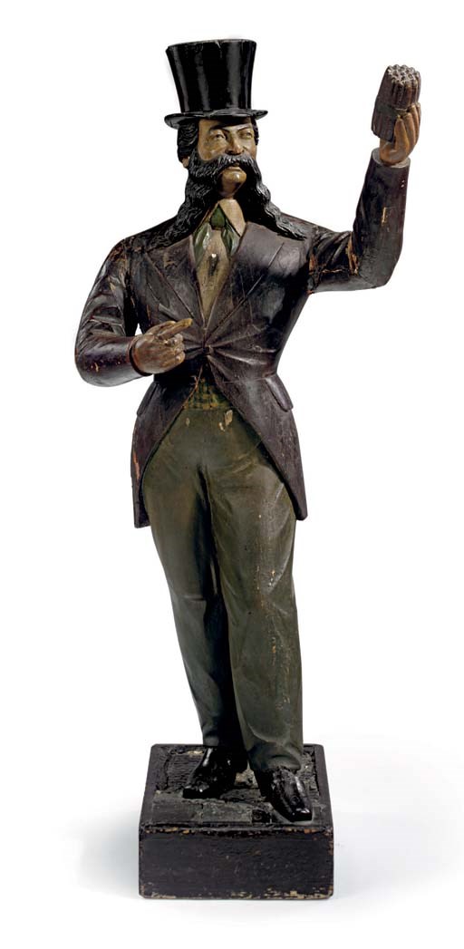 A CARVED AND PAINT DECORATED 'LORD DUNDREARY' TRADE FIGURE