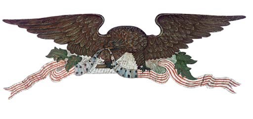 A CARVED AND PAINT DECORATED WALL EAGLE