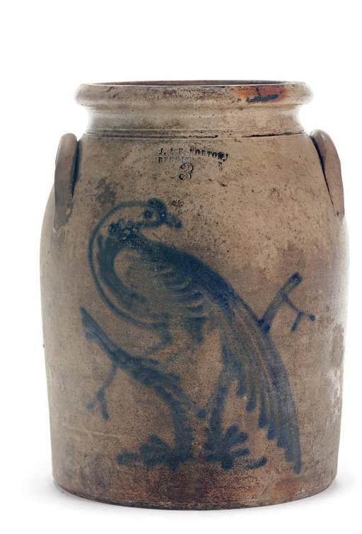 A STONEWARE TWO HANDLED CROCK WITH BIRD DECORATION