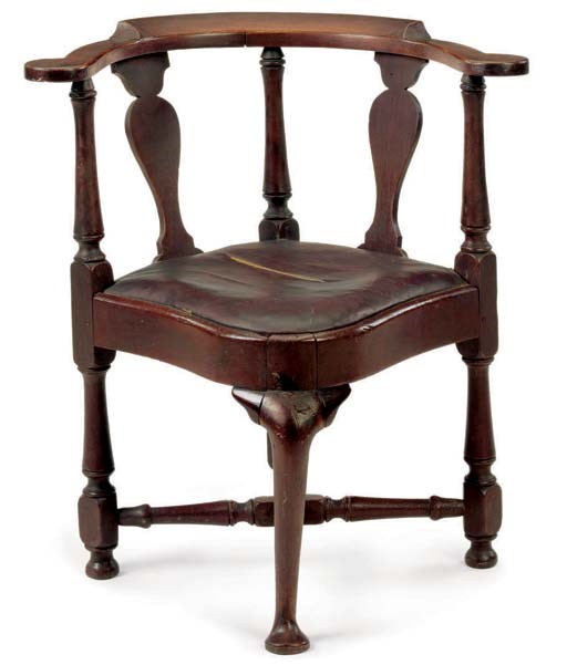 A CHIPPENDALE WALNUT CORNER CHAIR