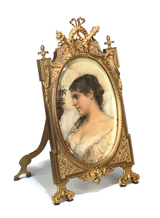 A LOUIS XVI STYLE ORMOLU PHOTOGRAPH FRAME