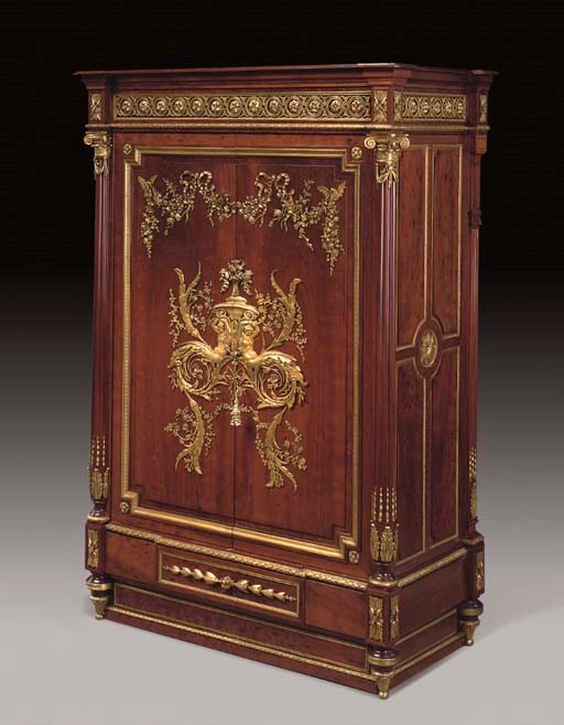 A LOUIS XVI STYLE ORMOLU-MOUNTED PLUM-PUDDING MAHOGANY BAS D'ARMOIRE