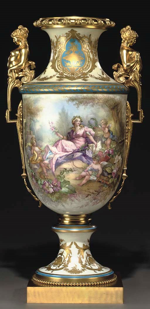 AN ORMOLU-MOUNTED SEVRES STYLE WHITE-GROUND VASE