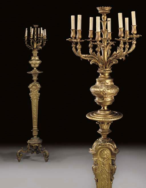 A PAIR OF REGENCE STYLE ORMOLU EIGHT-LIGHT CANDELABRA
