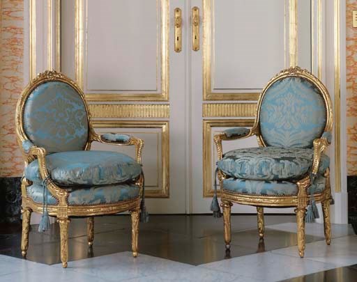 A PAIR OF LOUIS XVI STYLE GILTWOOD FAUTEUILS