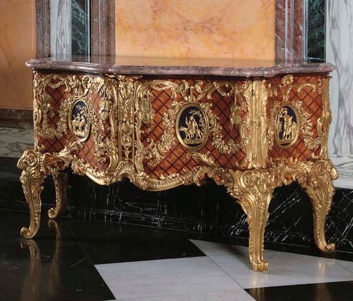 A REGENCE STYLE ORMOLU-MOUNTED TULIPWOOD, PARQUETRY AND BLUE-PAINTED COMMODE A VANTAUX