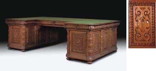 A MONUMENTAL CARVED OAK PEDESTAL DESK