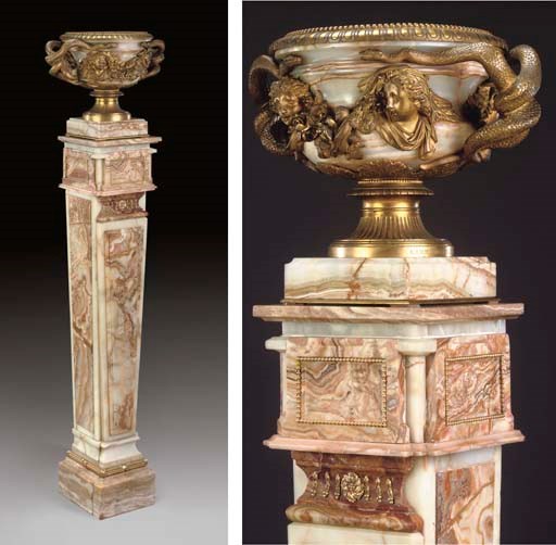 A FRENCH ORMOLU-MOUNTED ONYX REDUCTION OF THE WARWICK VASE, ON PEDESTAL