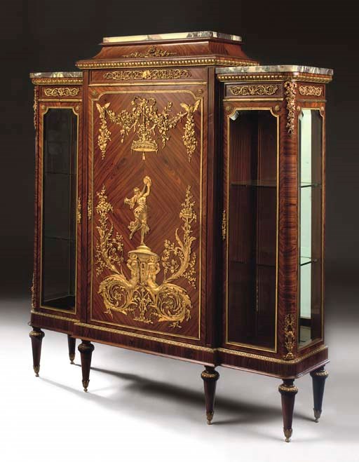 A LOUIS XVI STYLE ORMOLU-MOUNTED KINGWOOD BREAKFRONT VITRINE-CABINET