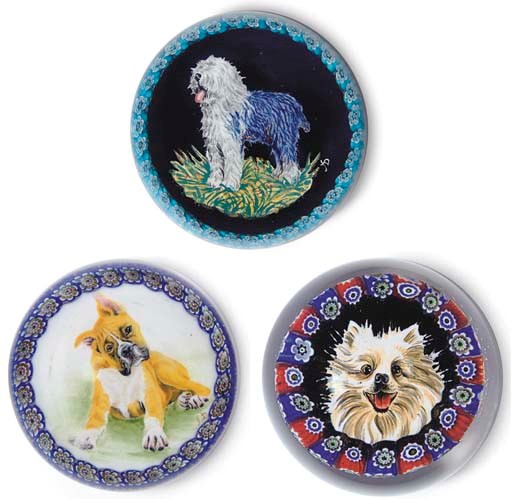 THREE MURANO GARLANDED DOG WEIGHTS