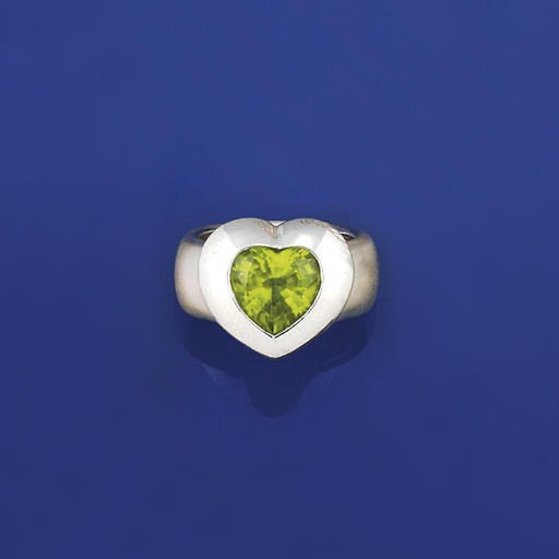 An 18ct. white gold peridot single stone ring, by Mouawad