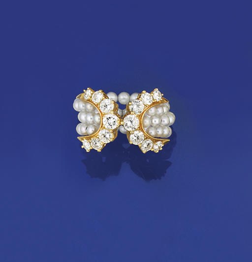 A cultured pearl and diamond ring