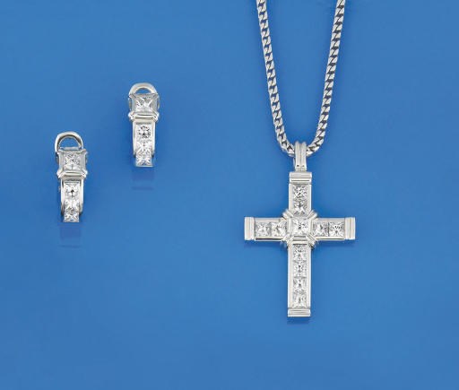 A DIAMOND CROSS PENDANT AND EARCLIPS