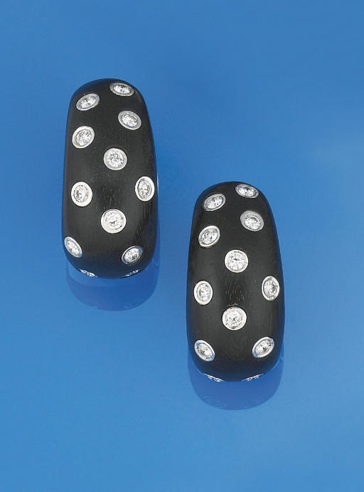 A pair of wood and diamond earrings