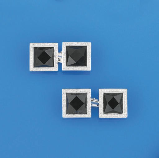 A pair of onyx and diamond cufflinks