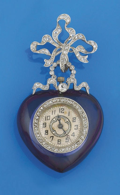 AN EARLY 20TH CENTURY AMETHYST AND DIAMOND FOB WATCH