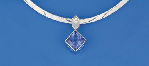 A TANZANITE AND DIAMOND PENDANT NECKLACE