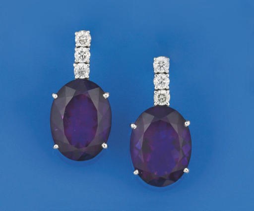 A pair of amethyst and diamond ear pendants