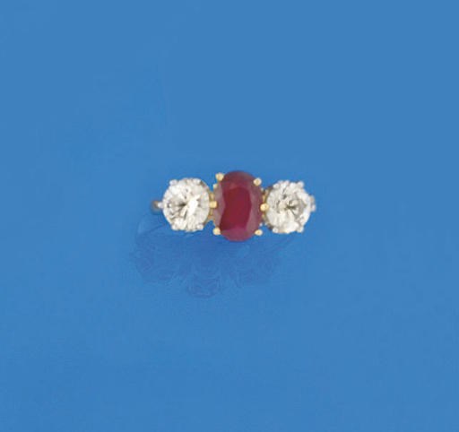 A RUBY AND DIAMOND THREE STONE RING