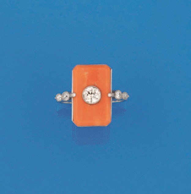 A coral and diamond ring