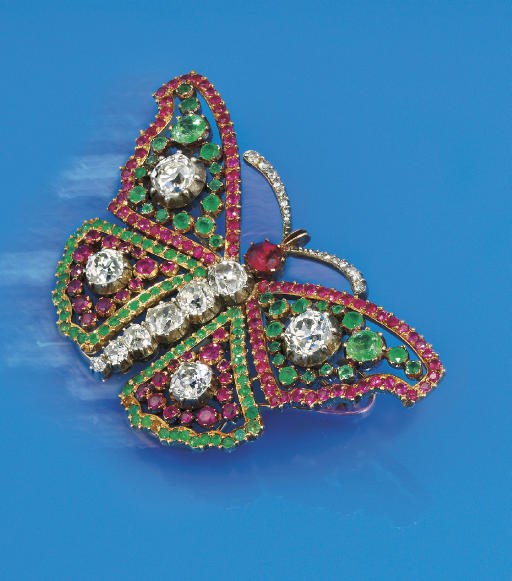 A diamond, emerald and ruby butterfly brooch