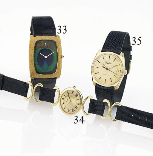 CORUM. A RARE LARGE 18K GOLD CUSHION WRISTWATCH WITH PEACOCK FEATHER DIAL