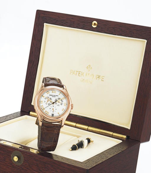 PATEK PHILIPPE. A FINE 18K PINK GOLD AUTOMATIC ANNUAL CALENDAR WRISTWATCH WITH CENTER SECONDS AND DATE