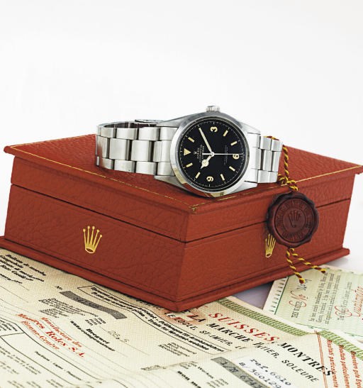 ROLEX. A FINE AND RARE STAINLESS STEEL AUTOMATIC WRISTWATCH WITH CENTER SECONDS, DATE, BRACELET, ORIGINAL BOX AND PAPERS