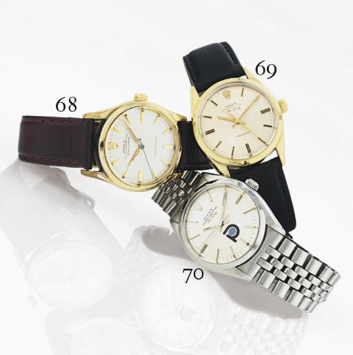 ROLEX. A STAINLESS STEEL AND GILT AUTOMATIC WRISTWATCH WITH CENTER SECONDS