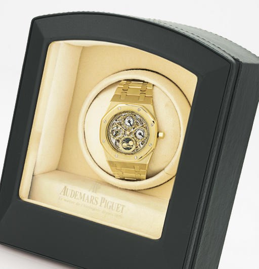 AUDEMARS PIGUET. A FINE AND RARE 18K GOLD TONNEAU SKELETONIZED AUTOMATIC PERPETUAL CALENDAR BRACELET WATCH WITH MOON PHASES