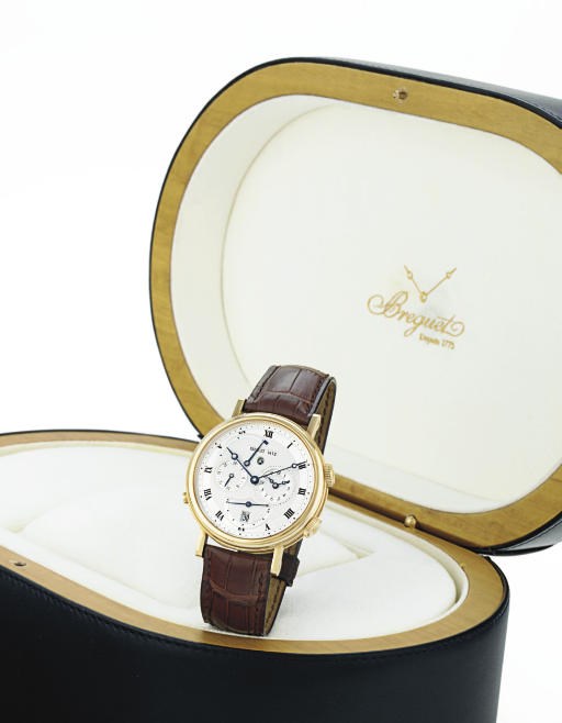 BREGUET. A LARGE 18K GOLD AUTOMATIC DUAL TIME WRISTWATCH WITH ALARM, DATE AND POWER RESERVE