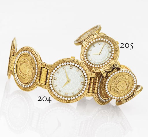 GIANNI VERSACE. A HEAVY 18K GOLD AND DIAMOND MEDALLION BRACELET WATCH