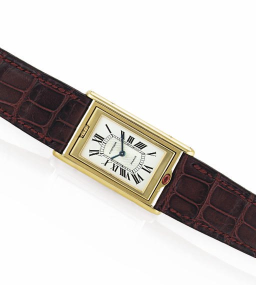 CARTIER.  A LIMITED EDITION 18K GOLD RECTANGULAR REVERSIBLE WRISTWATCH